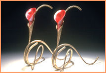 Pair of small bronze candelholders with copper inserts